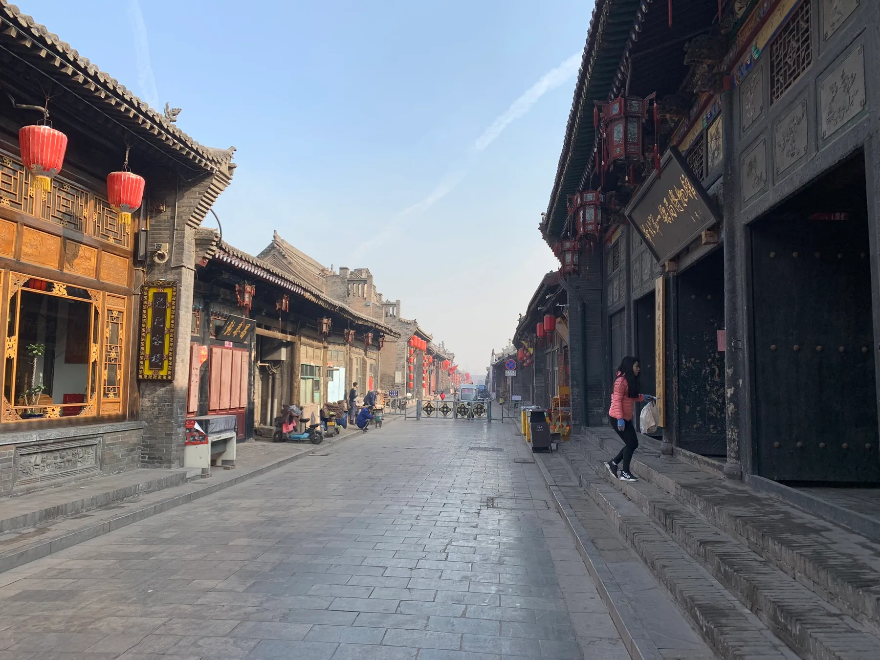 A quiet old street lined with shops in Pingyao.