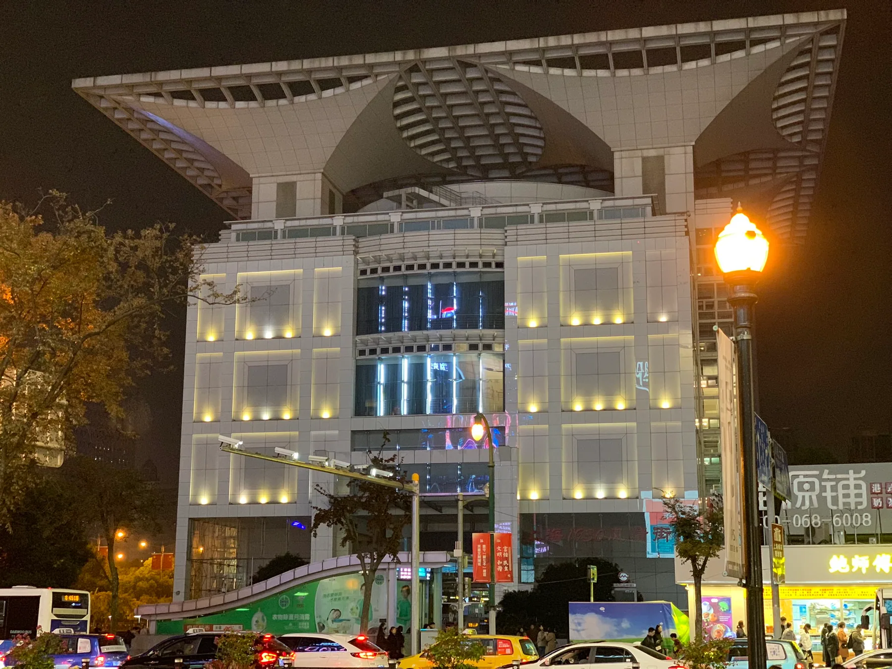 A bright building facade in Shanghai at night.