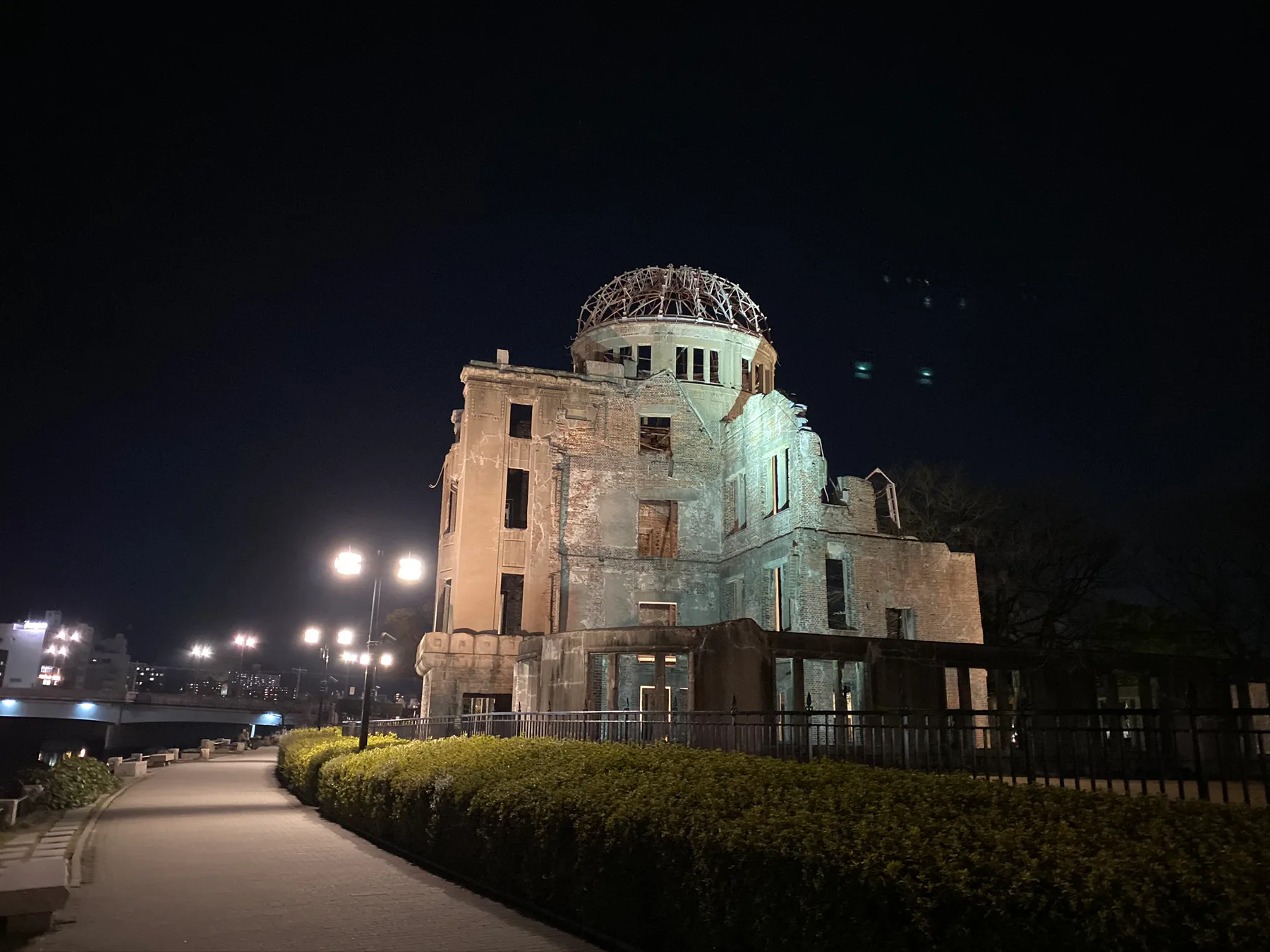 The Atomic Bomb Dome lit at night in Hiroshima.