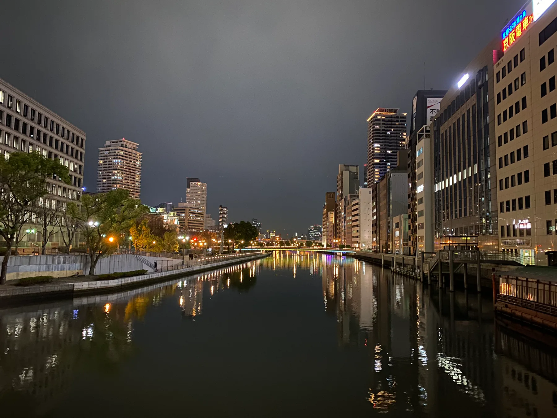 Canal lights reflected in Osaka at night.