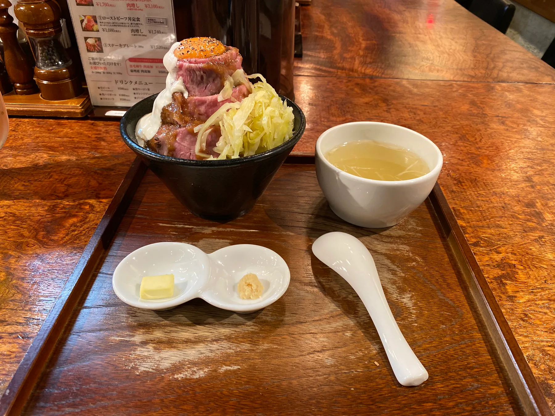 A ramen bowl on a wooden counter in Tokyo.