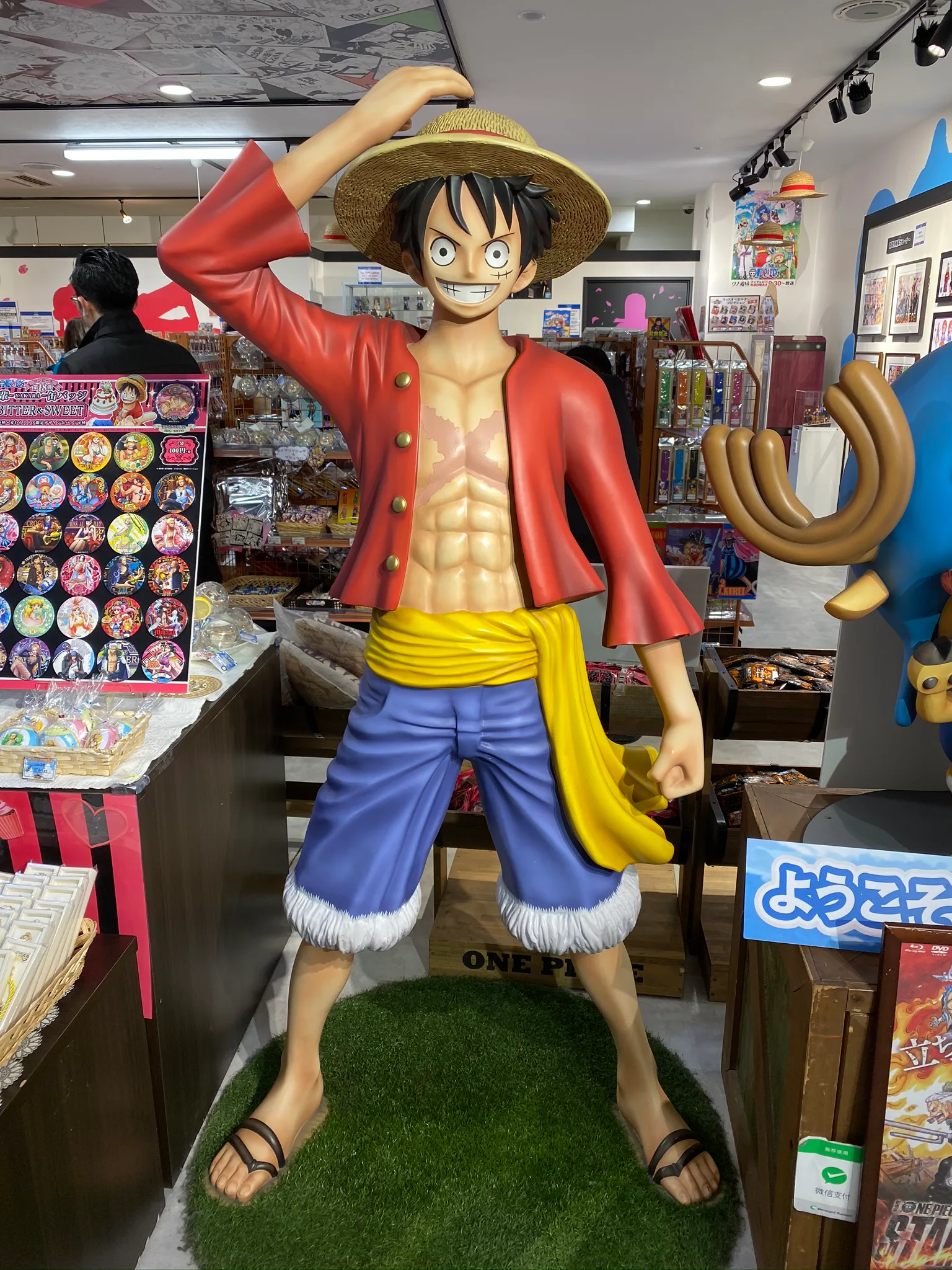 A large anime figure inside a Tokyo shop.