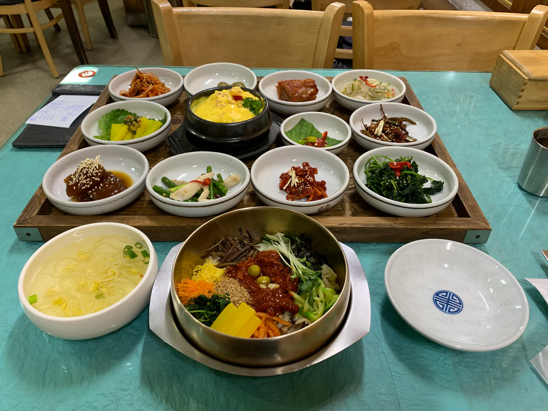 Bibimbap with side dishes on a table in Jeonju.