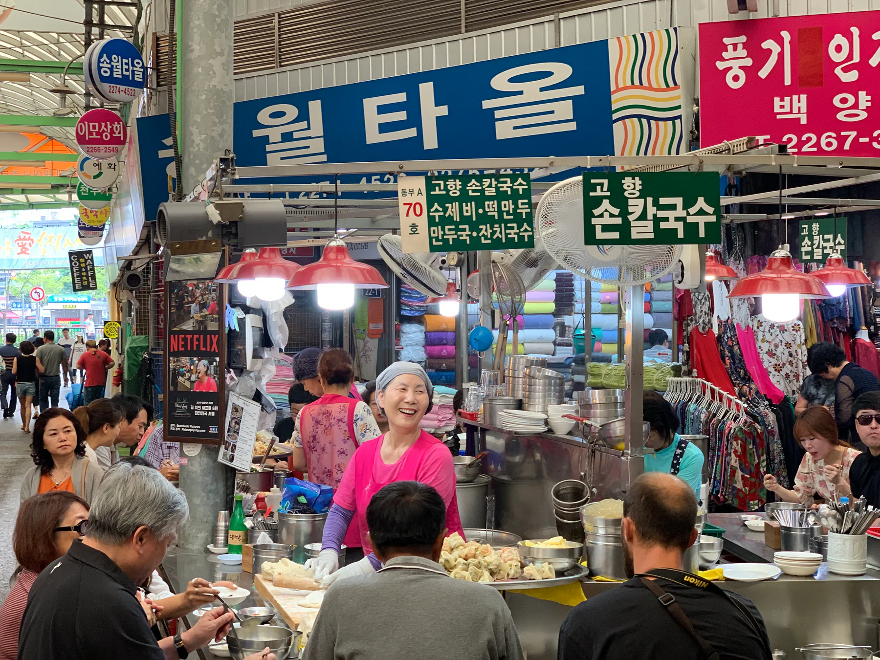 A busy food stall inside Gwangjang Market in Seoul.