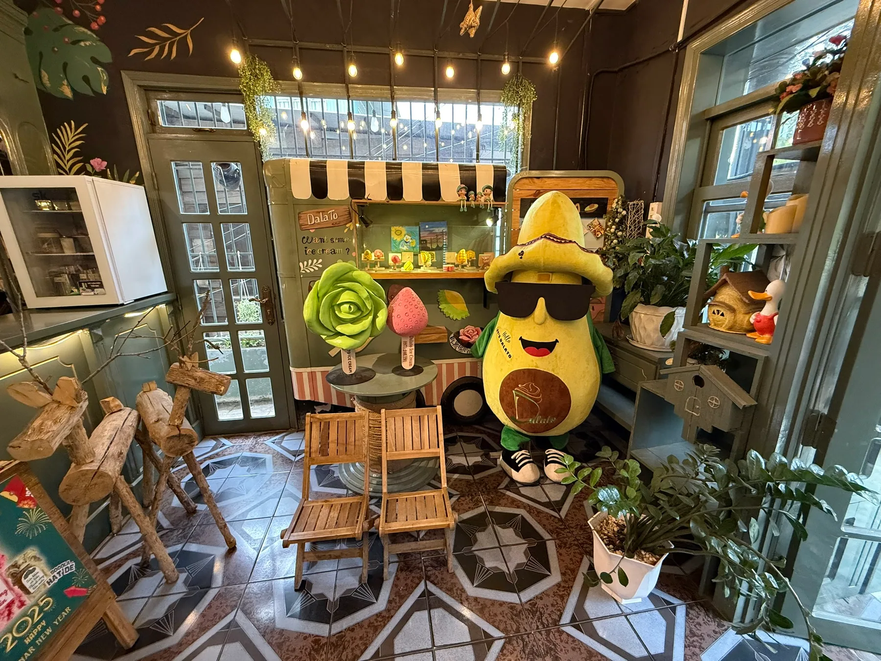 A small Da Lat café interior with chairs and a playful display.