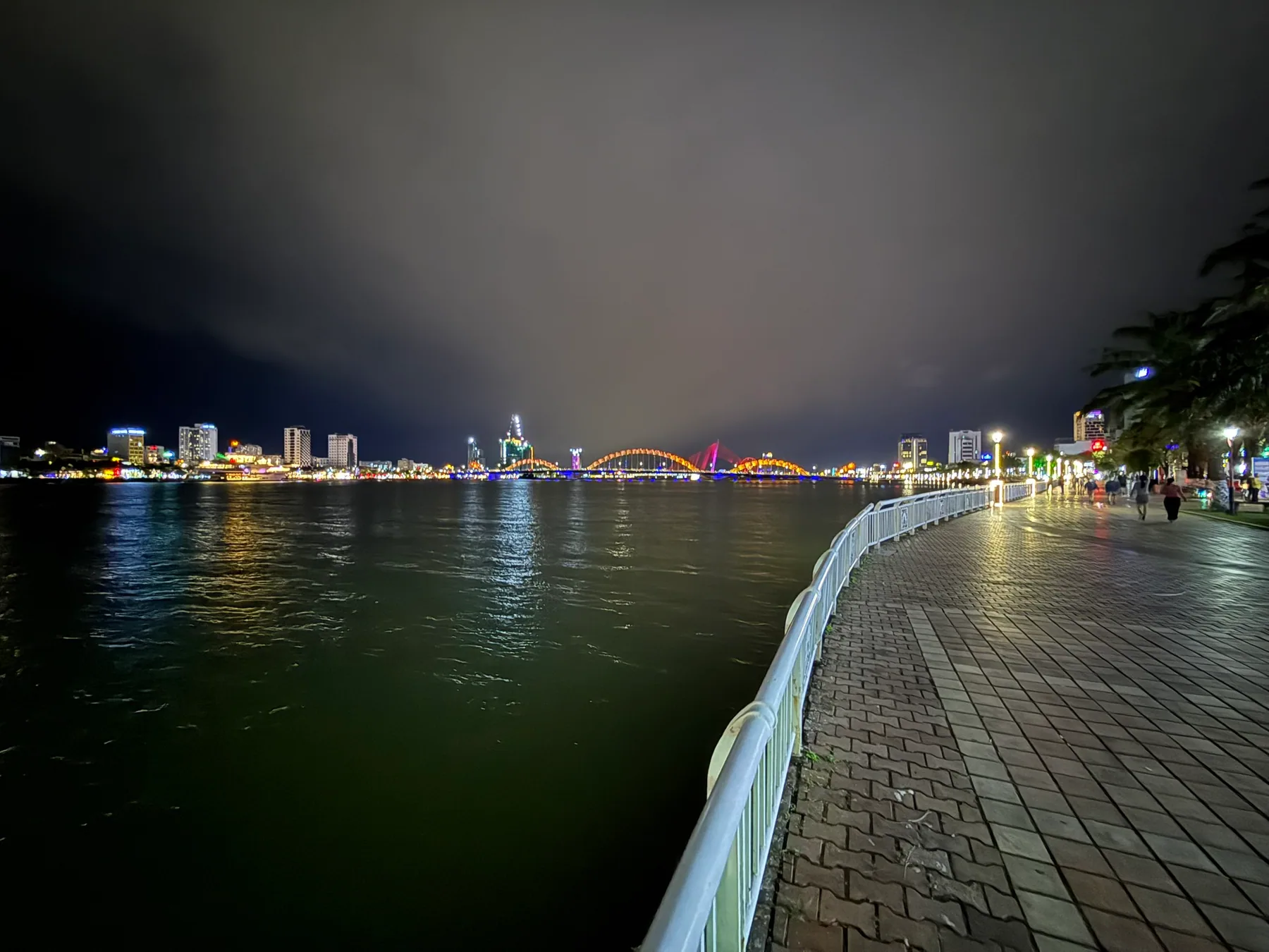 A nighttime walk beside the Hàn River in Da Nang.