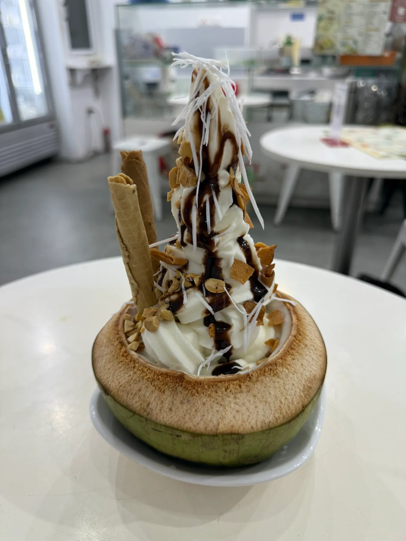 A final dessert served in a coconut shell in Hanoi.