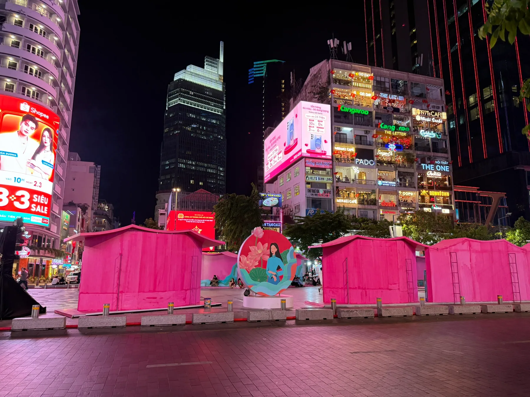 Bright city lights and street color in Ho Chi Minh City at night.
